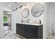 Bathroom with a double sink vanity, stylish mirrors, and views of the bedroom at 550 Stewart Nw Ave, Marietta, GA 30064