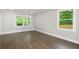 Bright bedroom featuring hardwood flooring, large windows and neutral walls at 550 Stewart Nw Ave, Marietta, GA 30064