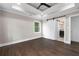 Bedroom with barn door to bathroom; hardwood flooring and lots of natural light at 550 Stewart Nw Ave, Marietta, GA 30064