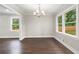 Newly refinished wood flooring, updated lighting and new windows create a relaxing formal dining room at 550 Stewart Nw Ave, Marietta, GA 30064
