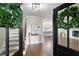 Welcoming entryway with hardwood floors and an open view to the kitchen and staircase at 550 Stewart Nw Ave, Marietta, GA 30064