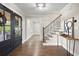 Hallway featuring hardwood floors, stylish staircase and a view to an outdoor porch at 550 Stewart Nw Ave, Marietta, GA 30064