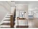 Inviting entryway showcasing a staircase and a glimpse of the adjacent kitchen at 550 Stewart Nw Ave, Marietta, GA 30064