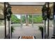 Entryway with a view to the outdoors showing a covered porch, wreath, and plants at 550 Stewart Nw Ave, Marietta, GA 30064