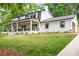 Well-maintained home with a spacious lawn, modern design, and a convenient garage at 550 Stewart Nw Ave, Marietta, GA 30064