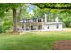 Beautiful home with a large front porch, modern black trim, and a spacious lawn at 550 Stewart Nw Ave, Marietta, GA 30064
