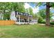 Charming two-story home with a welcoming front porch and a lush green lawn at 550 Stewart Nw Ave, Marietta, GA 30064