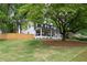 Beautifully landscaped front yard showcasing a charming home with a cozy front porch at 550 Stewart Nw Ave, Marietta, GA 30064