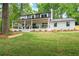 Charming two-story home featuring a spacious front porch and manicured landscaping at 550 Stewart Nw Ave, Marietta, GA 30064