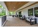 Inviting front porch with wood ceiling and plenty of seating offers relaxation and curb appeal at 550 Stewart Nw Ave, Marietta, GA 30064