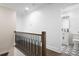 Hallway leading to a well-lit bathroom with patterned tile floors at 550 Stewart Nw Ave, Marietta, GA 30064