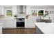 Modern kitchen features white cabinetry, stainless steel appliances, and quartz countertops at 550 Stewart Nw Ave, Marietta, GA 30064