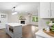 Bright kitchen with a white brick fireplace, stainless appliances, and large kitchen island at 550 Stewart Nw Ave, Marietta, GA 30064