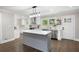 Modern kitchen with stainless steel appliances, kitchen island with pendant lights, and white cabinetry at 550 Stewart Nw Ave, Marietta, GA 30064