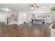 Open concept living space with stairs, entry, and a modern kitchen featuring dark hardwood flooring at 550 Stewart Nw Ave, Marietta, GA 30064