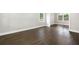 A formal dining room with newly refinished wood flooring and fresh paint at 550 Stewart Nw Ave, Marietta, GA 30064