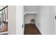 Storage nook under the stairs with hardwood flooring and a striped storage box at 550 Stewart Nw Ave, Marietta, GA 30064