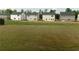 Spacious backyard view showcasing the new home community and lawn at 2197 Boxwood Cir, Conyers, GA 30094