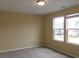 Bedroom with two windows for great natural light and neutral walls with a baseboard trim accent at 2197 Boxwood Cir, Conyers, GA 30094