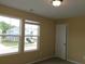 Bright bedroom featuring natural light from the windows and a view to a neighboring house at 2197 Boxwood Cir, Conyers, GA 30094