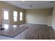 Open living space featuring stylish wood flooring and neutral color palette at 2197 Boxwood Cir, Conyers, GA 30094