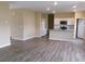 Open-concept living area with wood-look flooring, recessed lighting, and modern kitchen at 2197 Boxwood Cir, Conyers, GA 30094