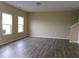 Neutral living room with lots of light, hard surface flooring, and a staircase at 2197 Boxwood Cir, Conyers, GA 30094