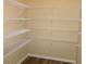 Spacious pantry featuring ample shelving, providing plenty of storage space at 2197 Boxwood Cir, Conyers, GA 30094