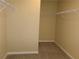 Empty walk-in closet with neutral walls, carpet, and wire shelving for optimal storage at 2197 Boxwood Cir, Conyers, GA 30094