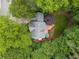 Aerial view of the home showcasing the private backyard, wooden deck, and mature trees at 3953 Lorien Nw Way, Kennesaw, GA 30152