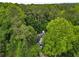 Aerial view of a home surrounded by lush greenery, showcasing its private setting at 3953 Lorien Nw Way, Kennesaw, GA 30152