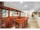 Basement with a built-in wet bar with lots of cabinets for storage and mirrored backsplash at 3953 Lorien Nw Way, Kennesaw, GA 30152