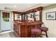 Another angle of the Basement bar, including stools and a window at 3953 Lorien Nw Way, Kennesaw, GA 30152