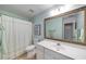Bathroom featuring a vanity with a sink, toilet, and shower with white shower curtain at 3953 Lorien Nw Way, Kennesaw, GA 30152
