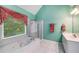 Bright bathroom featuring a large tub and separate glass-enclosed shower at 3953 Lorien Nw Way, Kennesaw, GA 30152