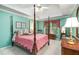 Spacious bedroom features a four-poster bed, soft lighting, and a serene ambiance at 3953 Lorien Nw Way, Kennesaw, GA 30152