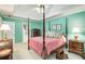 Airy main bedroom features a four-poster bed, plush carpeting, and a tranquil color scheme at 3953 Lorien Nw Way, Kennesaw, GA 30152