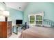Bedroom with a desk, dresser, and iron bed frame, perfect for relaxation or work at 3953 Lorien Nw Way, Kennesaw, GA 30152