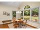 Bright dining area featuring a vaulted ceiling, pendant lighting, and large windows with natural light at 3953 Lorien Nw Way, Kennesaw, GA 30152