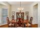 Formal dining room featuring hardwood floors, chair rail and chandelier, perfect for Gathering gatherings at 3953 Lorien Nw Way, Kennesaw, GA 30152