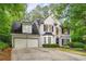 Exterior view of a two-story home with manicured landscaping and a two-car garage at 3953 Lorien Nw Way, Kennesaw, GA 30152