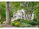 Exterior view of a two-story home with manicured landscaping and a two-car garage at 3953 Lorien Nw Way, Kennesaw, GA 30152