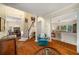 Spacious foyer showcasing hardwood floors, stairway and an open floor plan to living and dining areas at 3953 Lorien Nw Way, Kennesaw, GA 30152