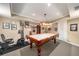 Spacious game room in finished basement with pool table and recreational equipment at 3953 Lorien Nw Way, Kennesaw, GA 30152