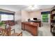 Home office with a large desk, comfortable seating, and built-in bookcase at 3953 Lorien Nw Way, Kennesaw, GA 30152