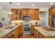 Modern kitchen with granite countertops, stainless steel appliances, and beautiful wood cabinetry at 3953 Lorien Nw Way, Kennesaw, GA 30152