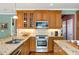 Modern kitchen with granite countertops, stainless steel appliances, and ample cabinet space for an efficient cooking experience at 3953 Lorien Nw Way, Kennesaw, GA 30152