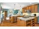 Open kitchen with stainless steel appliances, granite countertops, and a central island with cooktop at 3953 Lorien Nw Way, Kennesaw, GA 30152