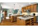 Stylish kitchen featuring granite countertops, stainless steel appliances, an island, and an open layout connecting to the living area at 3953 Lorien Nw Way, Kennesaw, GA 30152
