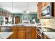 Open-concept kitchen featuring granite countertops, stainless steel appliances, and seamless flow to the adjacent living spaces at 3953 Lorien Nw Way, Kennesaw, GA 30152